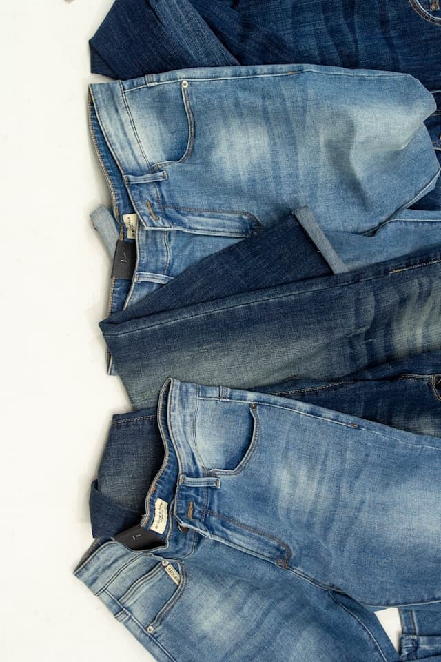 Stack of washed blue denim jeans
