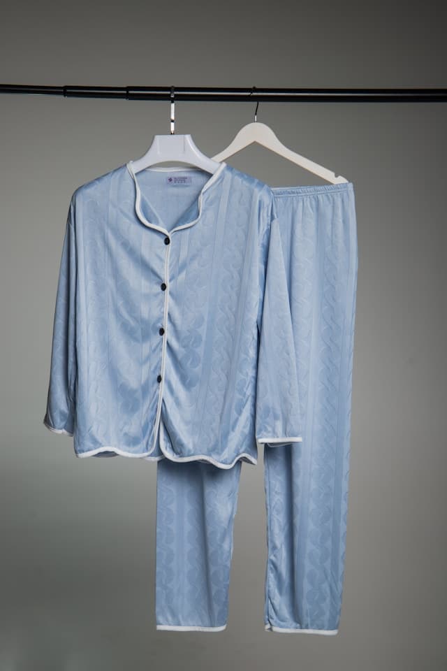 Pale blue pyjama set hanging on a rail