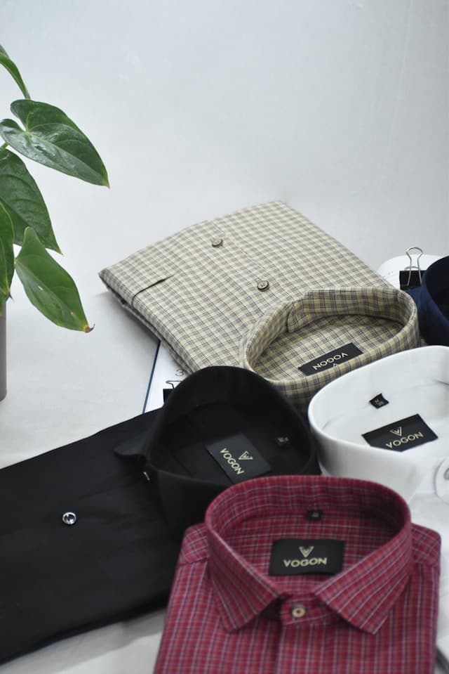 Folded checked and plain formal shirts