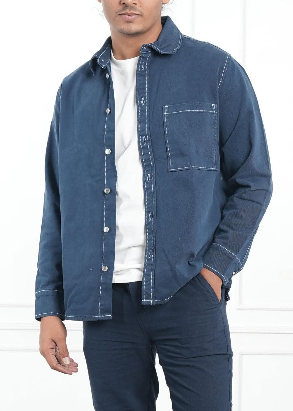 Model wearing a navy contrast-stitch overshirt